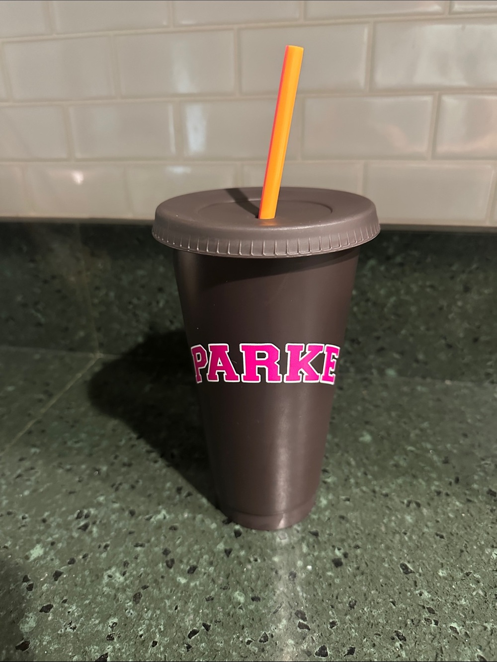 Dunkin’ Parke Collab Reusable Cup _Brown Tumbler with Pink Logo and Orange Straw